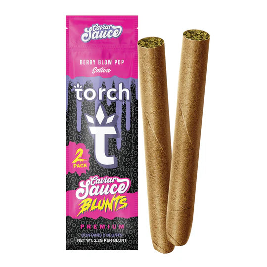 A package labeled "Berry Blow Pop Sativa" showcasing two “Torch Caviar Sauce Blunts 2ct | 4.4g” with THC-A flower is visible. The brand is Torch, and the product name is Caviar Sauce Blunts. The package mentions a 2-pack with a net weight of 2.2g per blunt, enhanced by strain-specific terpenes.