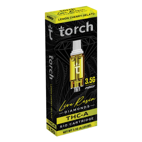 A black and yellow box labeled "Torch" features a 510 cartridge image, highlighting "Live Resin Diamonds," "THC-A," and "3.5G." Text reads "Lemon Cherry Gelato Hybrid." Net weight is 3.5g (0.123 oz). This Torch Live Resin Diamonds Cartridge | 3.5g from Torch promises a premium vaping experience.