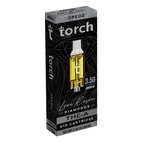 Packaging for a Torch Live Resin Diamonds Cartridge | 3.5g, labeled "3.5G INDICA, Oreoz," with a yellow cartridge image in the center. The sleek black box features silver and white text, highlighting that it's a premium 510 cartridge from Torch.