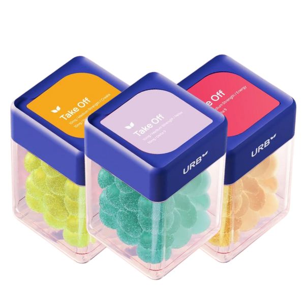 Three containers of Urb Take Off Skybites Gummies are displayed, each showcasing various colored THC gummies and vibrant labels on the top. These Delta-9 Skybites by Urb are hemp-derived for a flavorful experience.