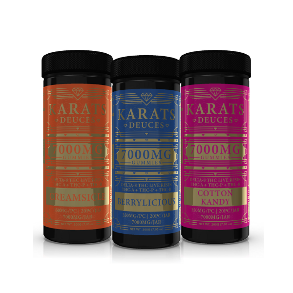 Three jars of Carats Karats Deuces Live Resin Gummies | 7000mg in flavors Creamsicle, Berrylicious, and Cotton Kandy, each containing 7,000mg THC per bottle.