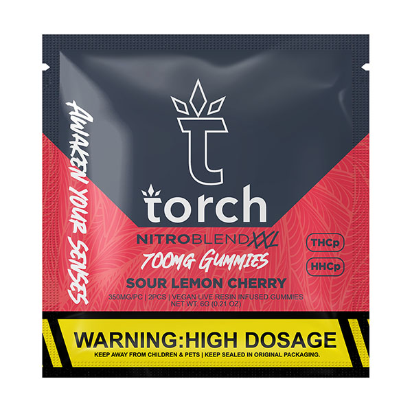 The black and red packaging of Torch Nitro Blend XXL 700mg Gummies | 2ct Sour Lemon Cherry flavored THC gummies highlights "700mg Gummies" with THC-P, HHCP, and live resin. It includes a high dosage warning and is proudly labeled vegan by Torch.