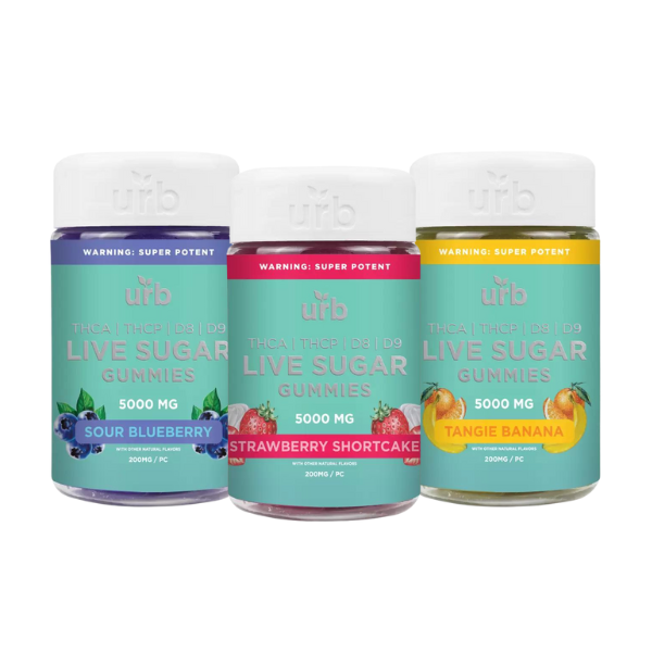 Three jars of Urb THCA Live Sugar Gummies | 5000mg are shown. Each jar is labeled with its respective flavor: Sour Blueberry, Strawberry Shortcake, and Tangie Banana. Infused with cannabis extract, each jar contains 5000 mg of cannabinoids.