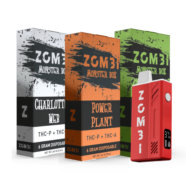 Three boxes labeled Zombi Monster Box Disposable | 6g in different colors stand behind a red disposable vape pen. The boxes are labeled "Charlotte's Web," "Power Plant," and an unspecified green one, each possibly enhancing your experience with Delta 8 or THC-P.