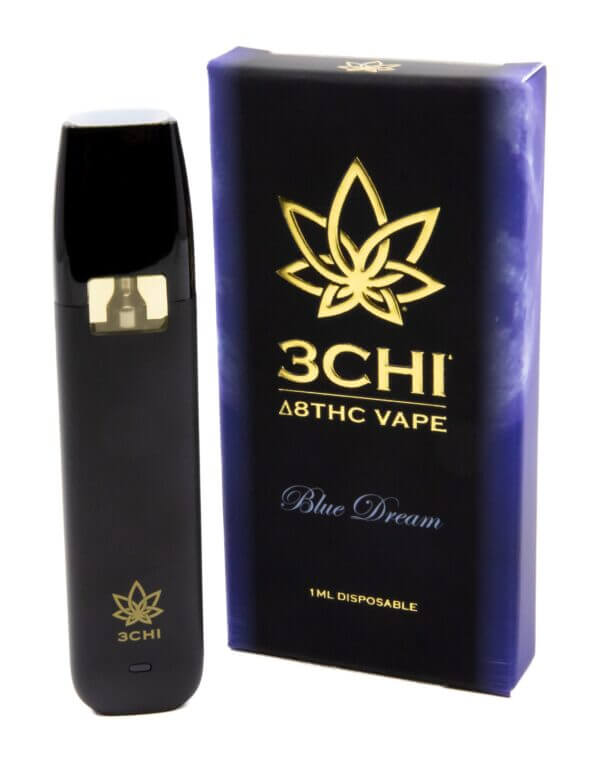 Image of a 3Chi Delta 8 Disposable Vape and its packaging box labeled "Blue Dream - 1 ML Disposable." The hemp-derived vape device and box feature a gold lotus logo.